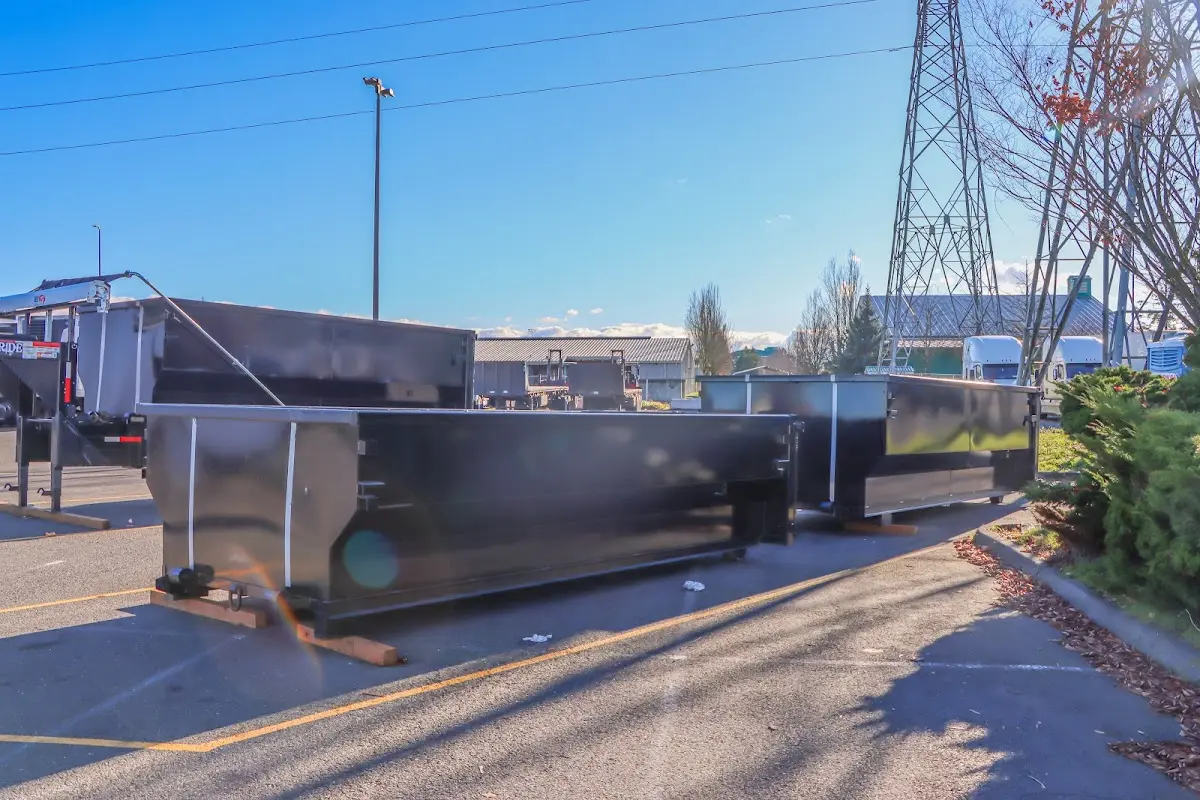 Roll-off dumpster ready for waste disposal at job site for Concrete Dumpster Rental in West Haven